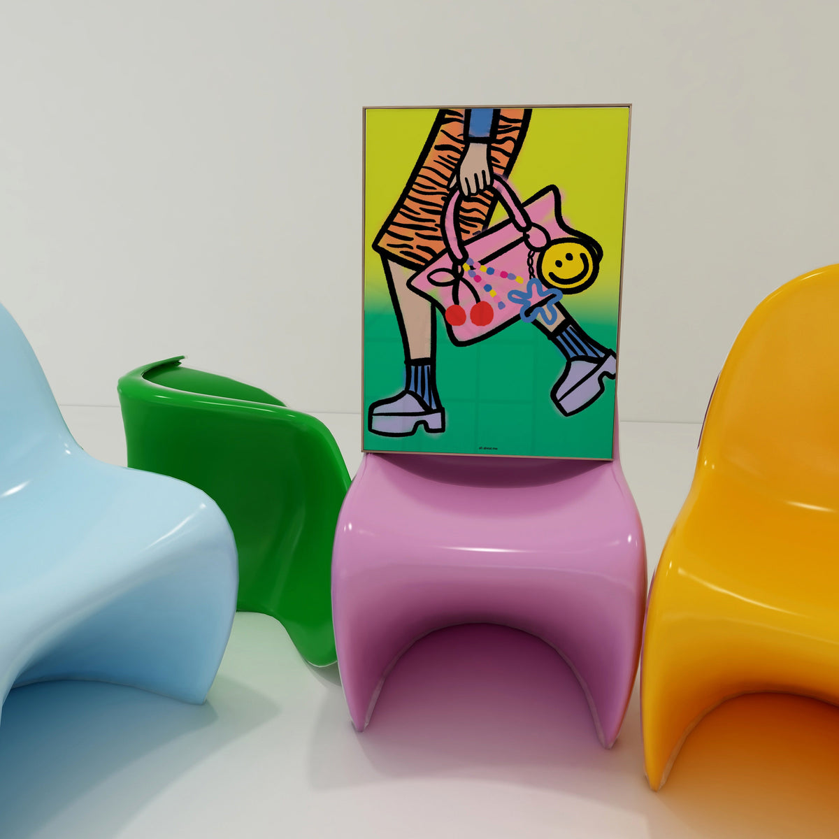 Colorful chairs with a small abstract painting on a white wall