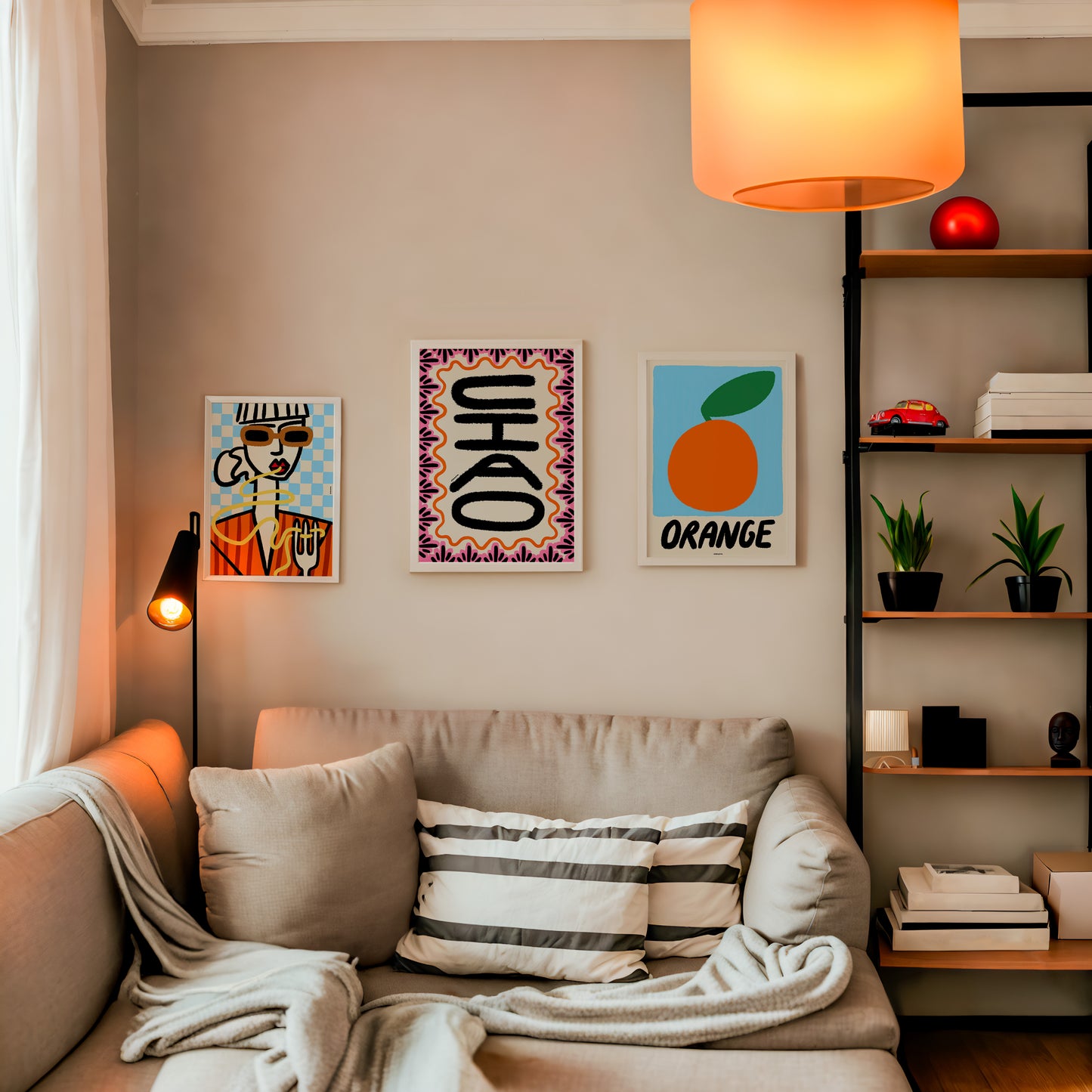 Bring the charm of Italy to your walls with this Dolce Vita Gallery Wall. Features whimsical illustrations, colorful type, and Sicilian-inspired scenes for a fun, empowering display. Living room with a couch, decorative pillows, and wall art.
