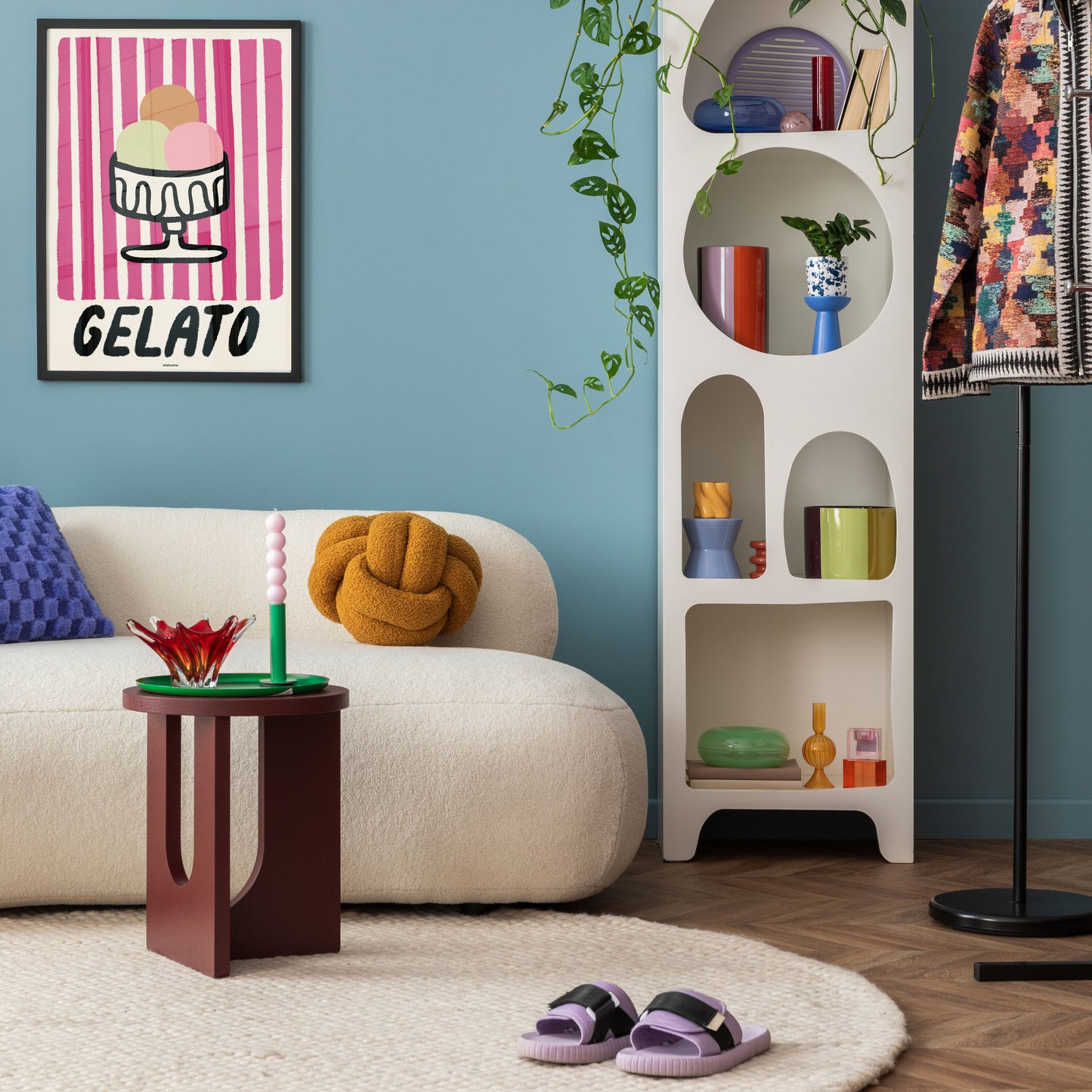 Celebrate Sicily’s iconic gelato with this playful Gelato stripe Print.
Living room with a couch, coffee table, bookshelf, and decorative items.