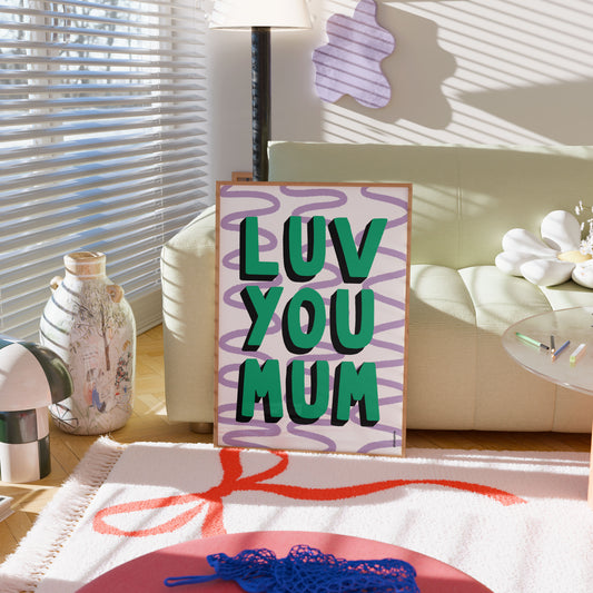 Decorative sign with 'LUV YOU MUM' text in a home setting