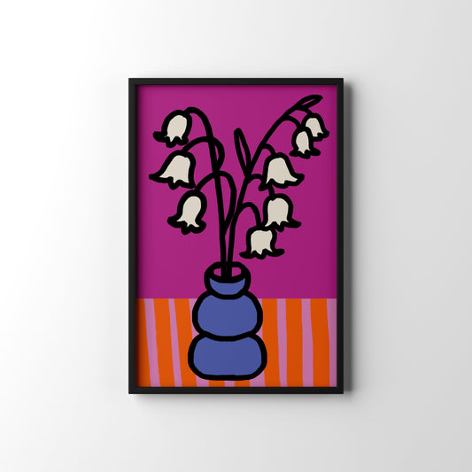 Graceful Lily of the Valley art print for May birthdays. A timeless botanical illustration symbolising sweetness and new beginnings. Framed artwork of a vase with white flowers on a pink background