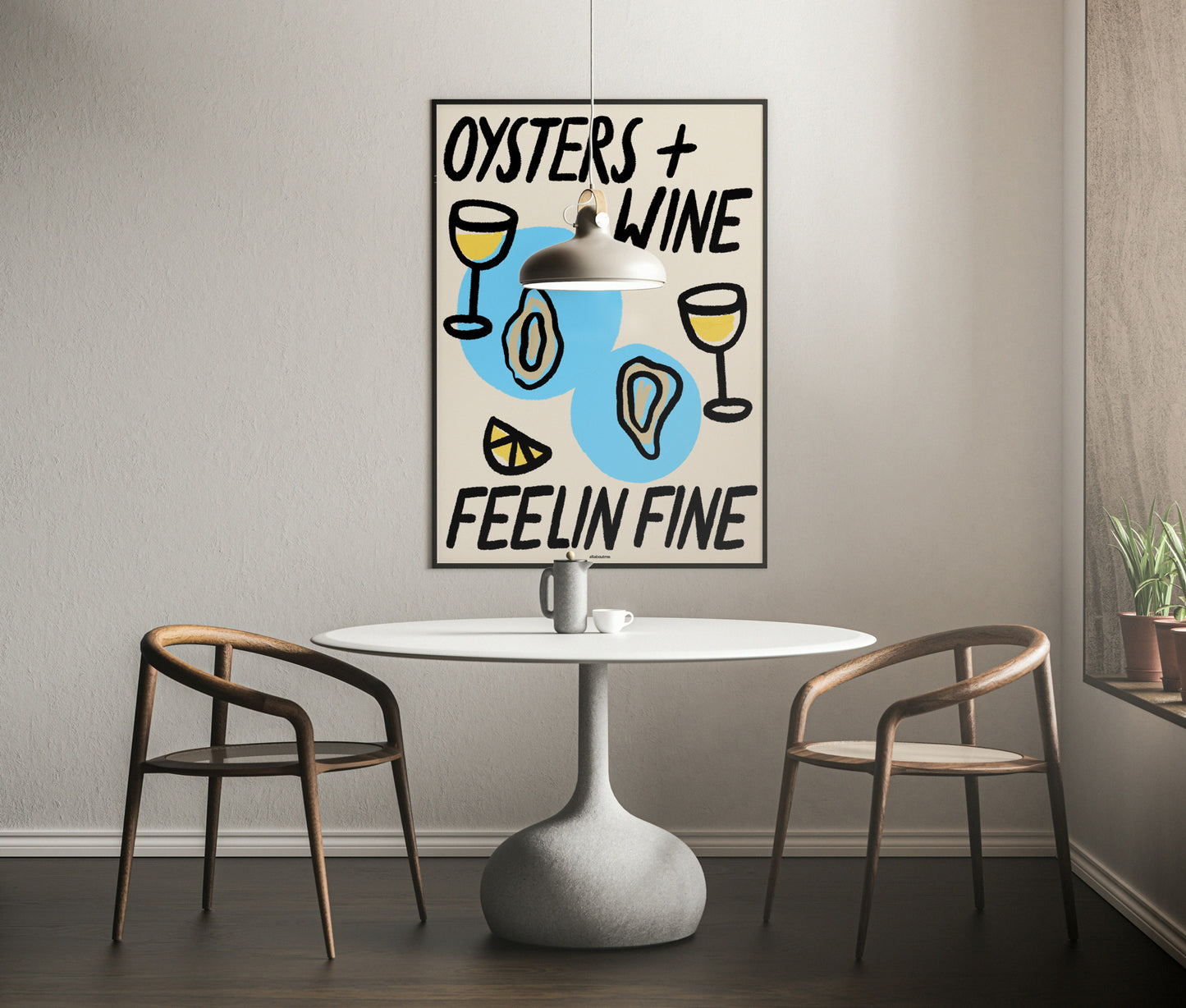 Dining room with a table and chairs, featuring a framed poster with 'Oysters + Wine Feelin' Fine' text.