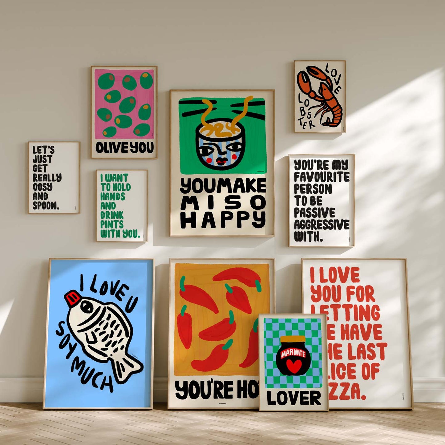 Collection of colourful love dopamine decor framed all about me artworks on a wall