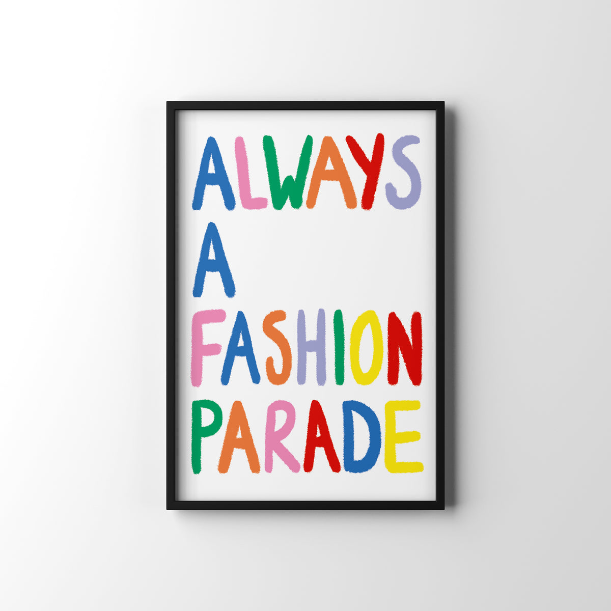 Framed poster with colorful text 'ALWAYS A FASHION PARADE' on a white background