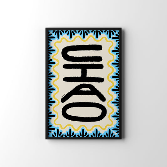Framed artwork with black text on a blue and yellow patterned background