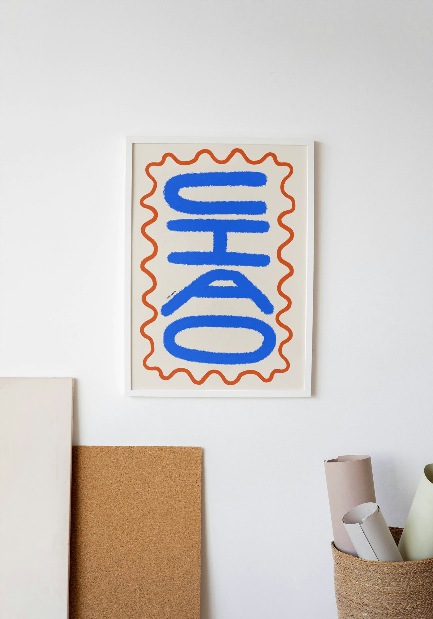 Decorative poster with 'ciao' design on a white wall.