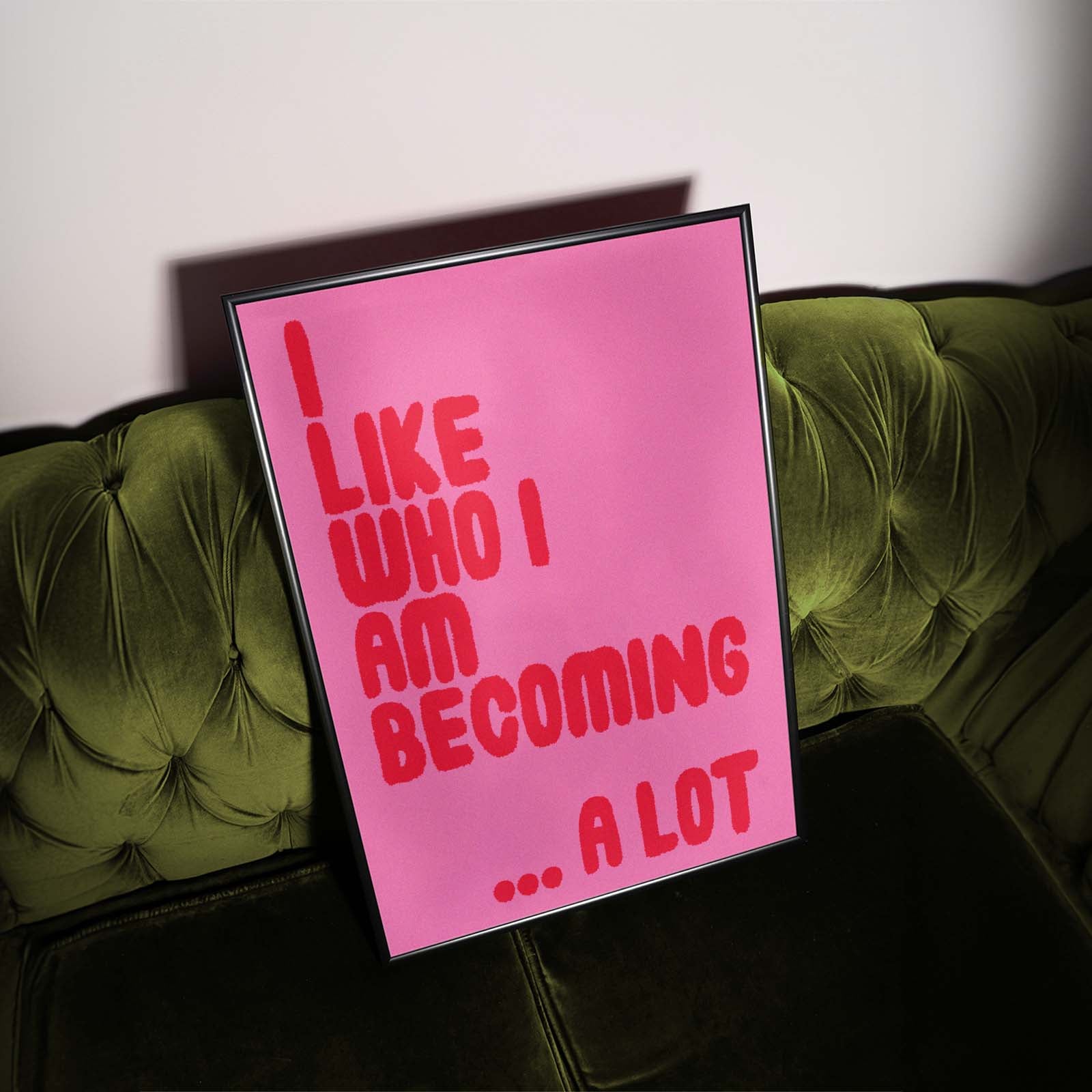 Red Type on pink slogan celebrating confidence, growth and self-belief inspired by becoming yourself.