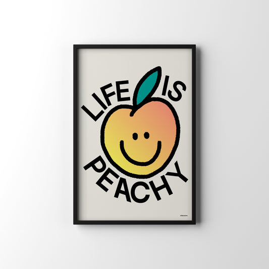 Framed artwork with a smiley peach and 'Life is Peachy' text on a white background