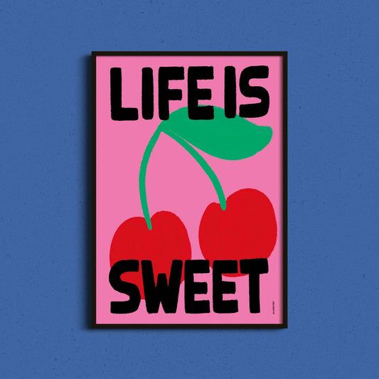 Colourful cherry illustration art print featuring the words "Life Is Sweet" on a pink background with playful hand lettering.