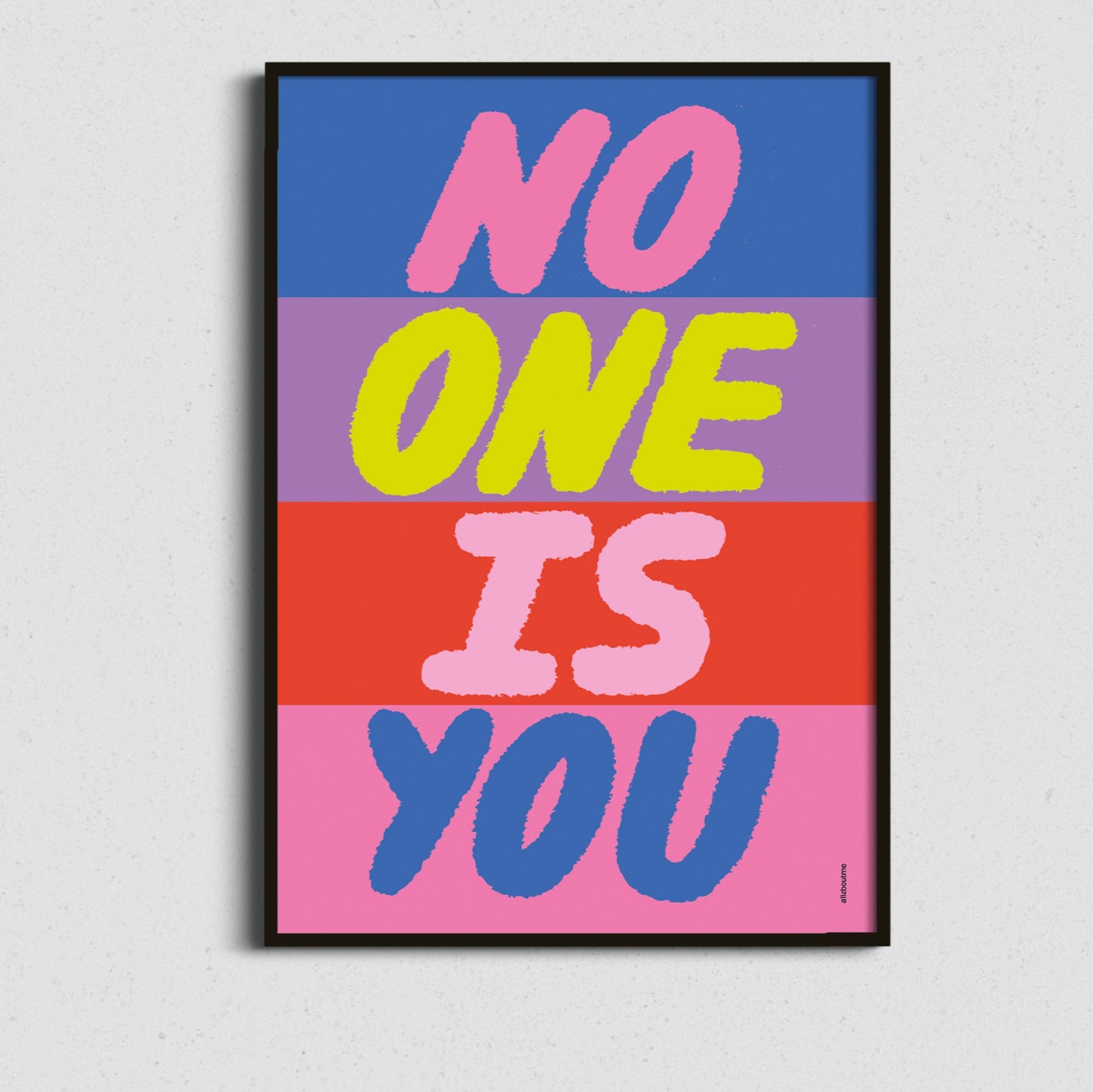  Framed colourful affirmation art featuring “No One Is You” in a bold block-style layout – positive and vibrant wall art.