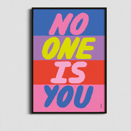  Framed colourful affirmation art featuring “No One Is You” in a bold block-style layout – positive and vibrant wall art.