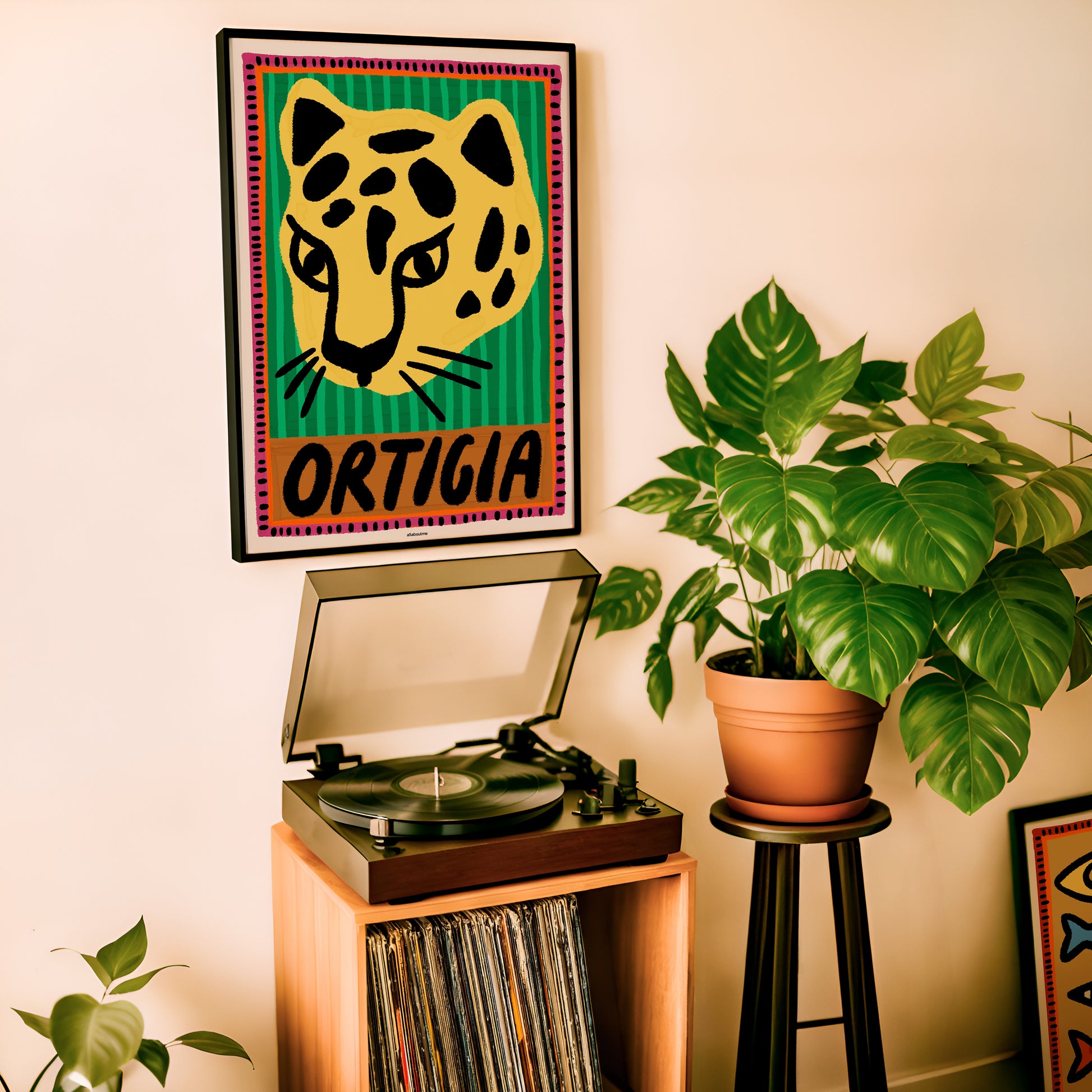 Stylish leopard wall art inspired by Ortigia, Sicily. Perfect for bold and contemporary home decor or Italian-themed interiors.
Turntable with vinyl records, potted plant, and framed artwork on a wall.