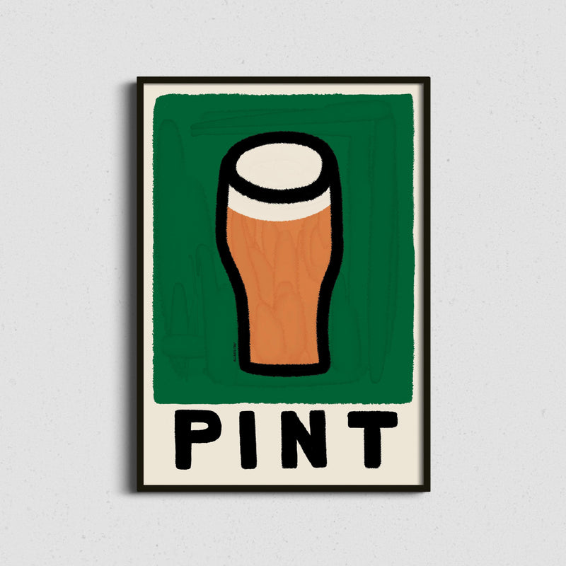 A framed art print featuring a stylized pint glass with a green background and the word 'PINT' below, displayed against a light gray textured wall.