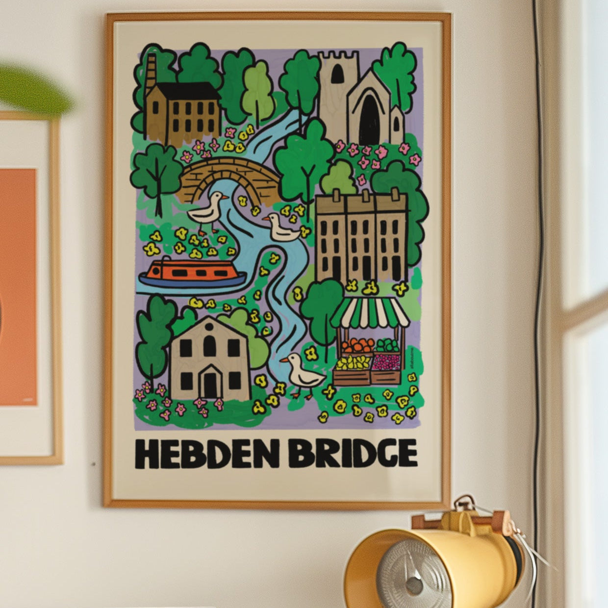 Framed artwork of Hebden Bridge on a wall with vintage stereo equipment below.