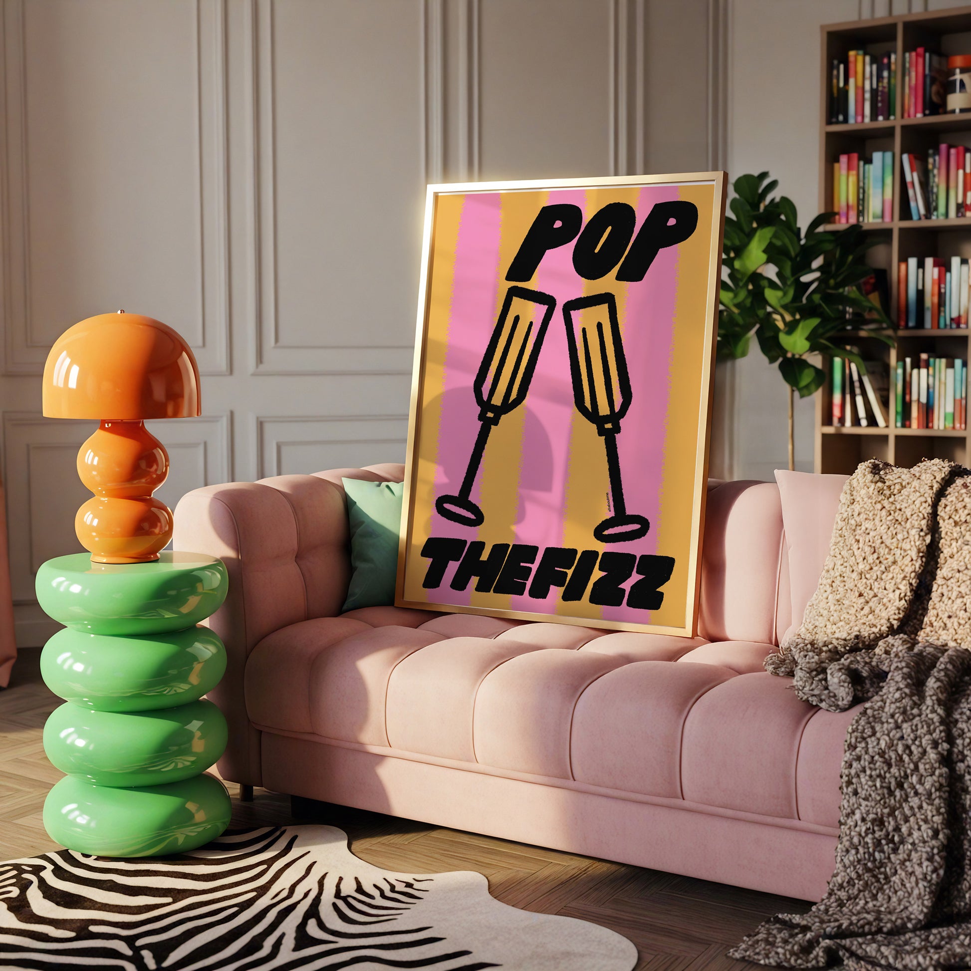 Modern living room with pink sofa, colorful lamp, and 'Pop The Fizz' poster.