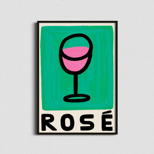 Framed artwork with a glass of pink blush rosé wine and the word 'ROSÉ' on a green background.