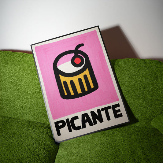 Poster with 'PICANTE' logo on a pink background, placed on a green surface.